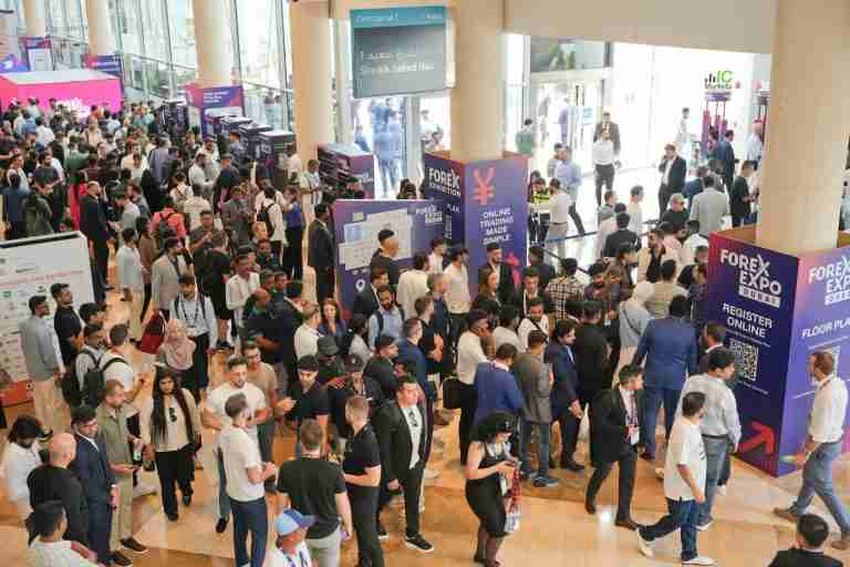 Crowds of traders and exhibitors on the Forex Expo Dubai show floor at Dubai World Trade Centre